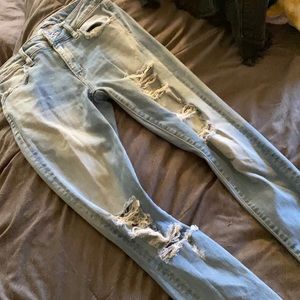 Light wash torn skinny jeans